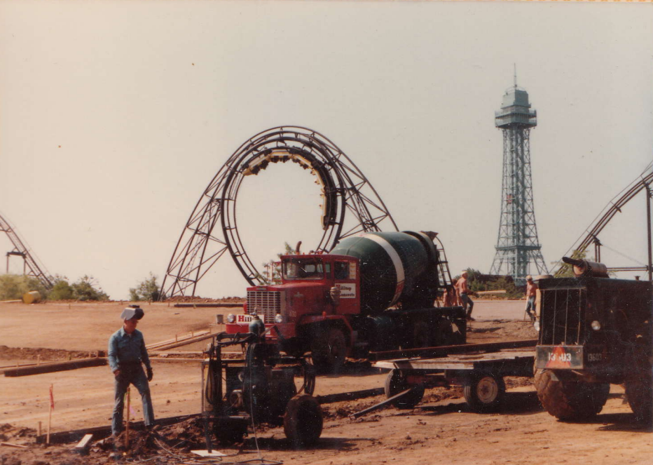 construction crew working at Kings Island with coaster and Eiffel Tower in background